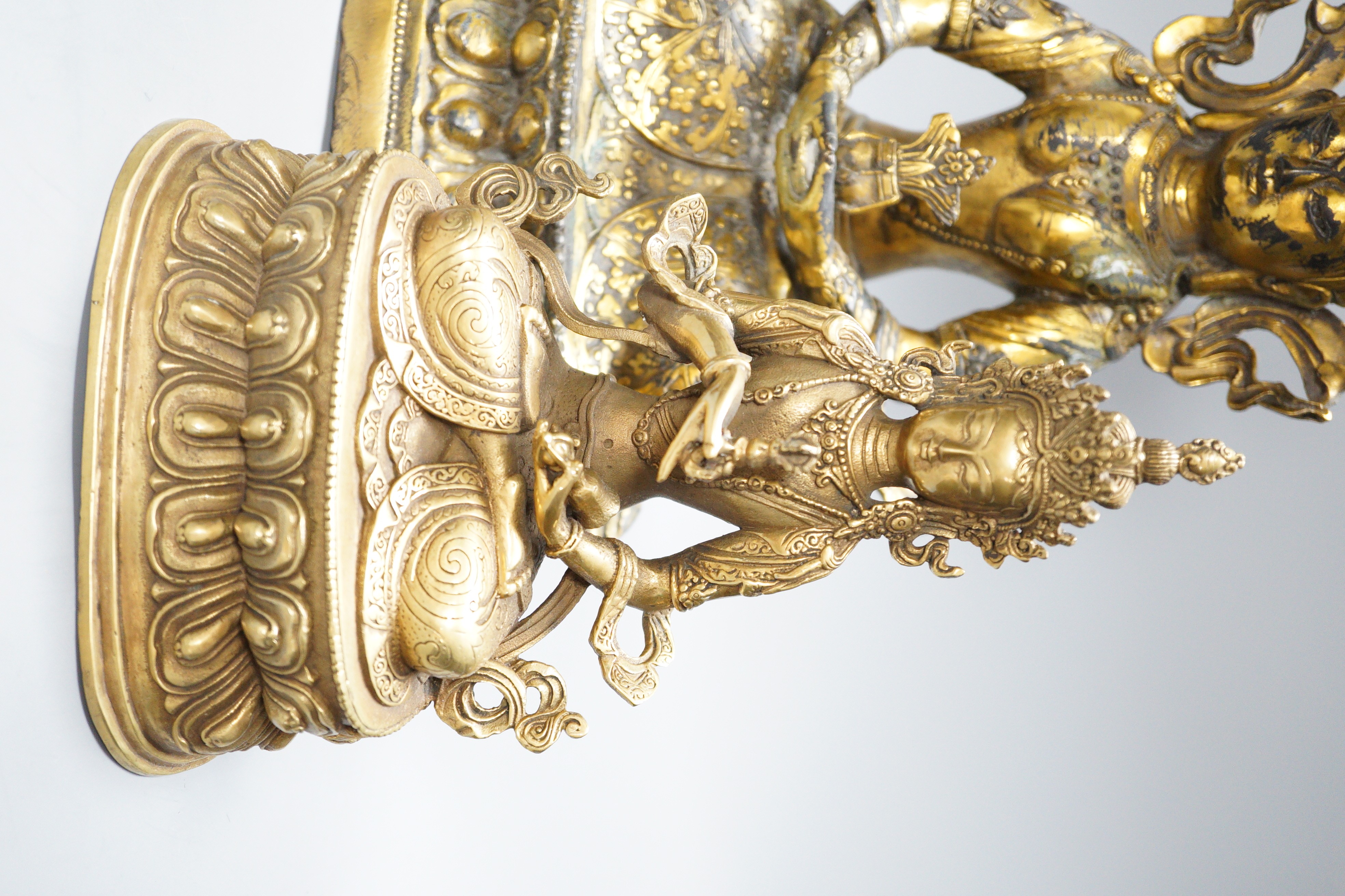 Two Himalayan bronze bodhisattvas and two opium pipes